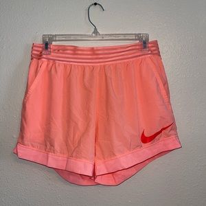 Nike coral/salmon light weight dri fit shorts with pockets